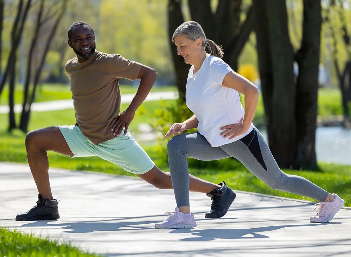 Mature couple having a workout together in the park