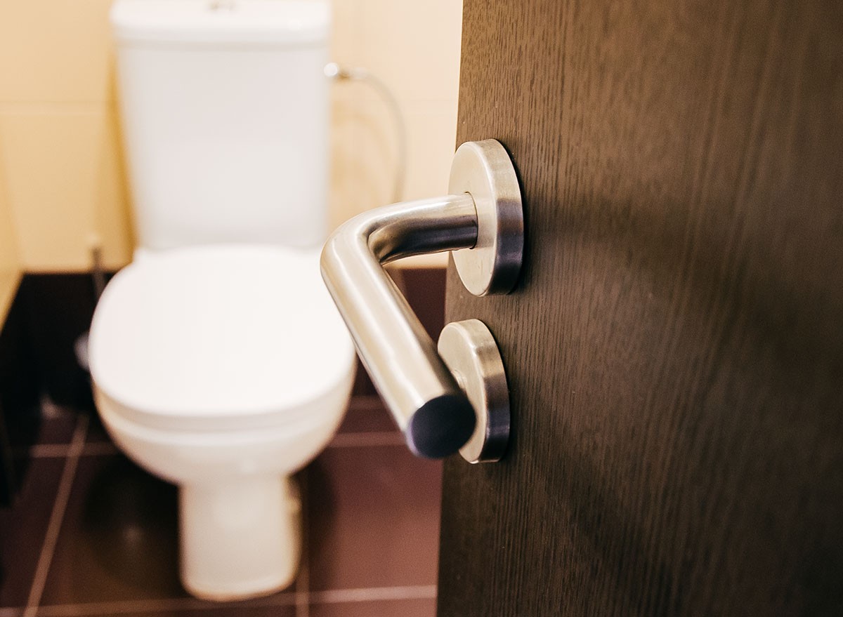 Door handle open to toilet can see toilet