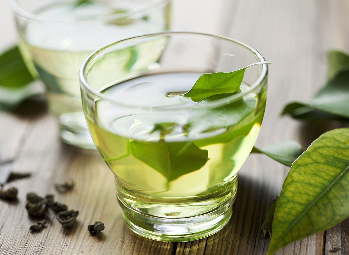 glass cup with fresh green tea