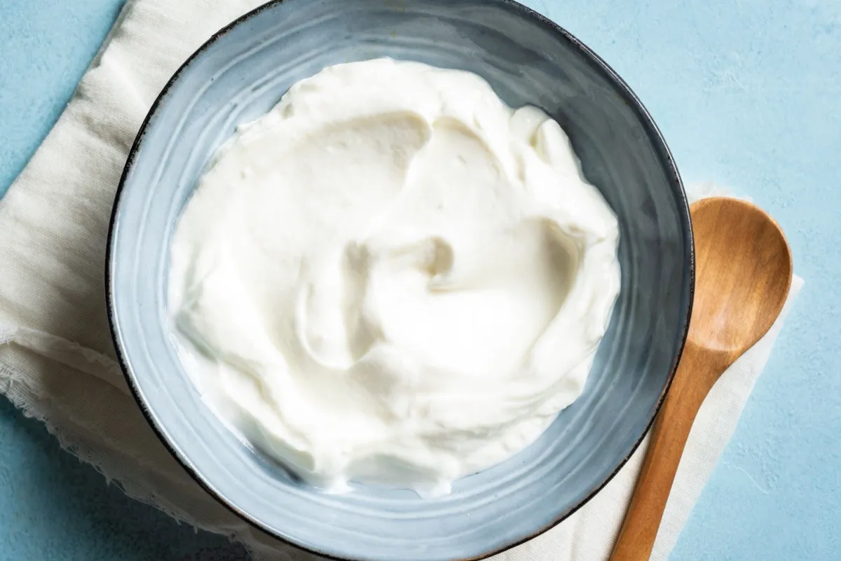 Homemade,Greek,Yogurt,In,Blue,Bowl,Close,Up,,Top,View.