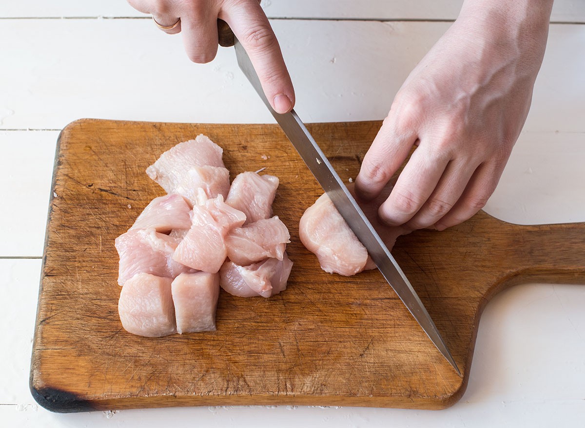Chicken fillet in the process of cutting kitchen, cooking