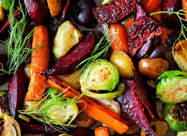 Full background of roasted colorful autumn vegetables, above view
