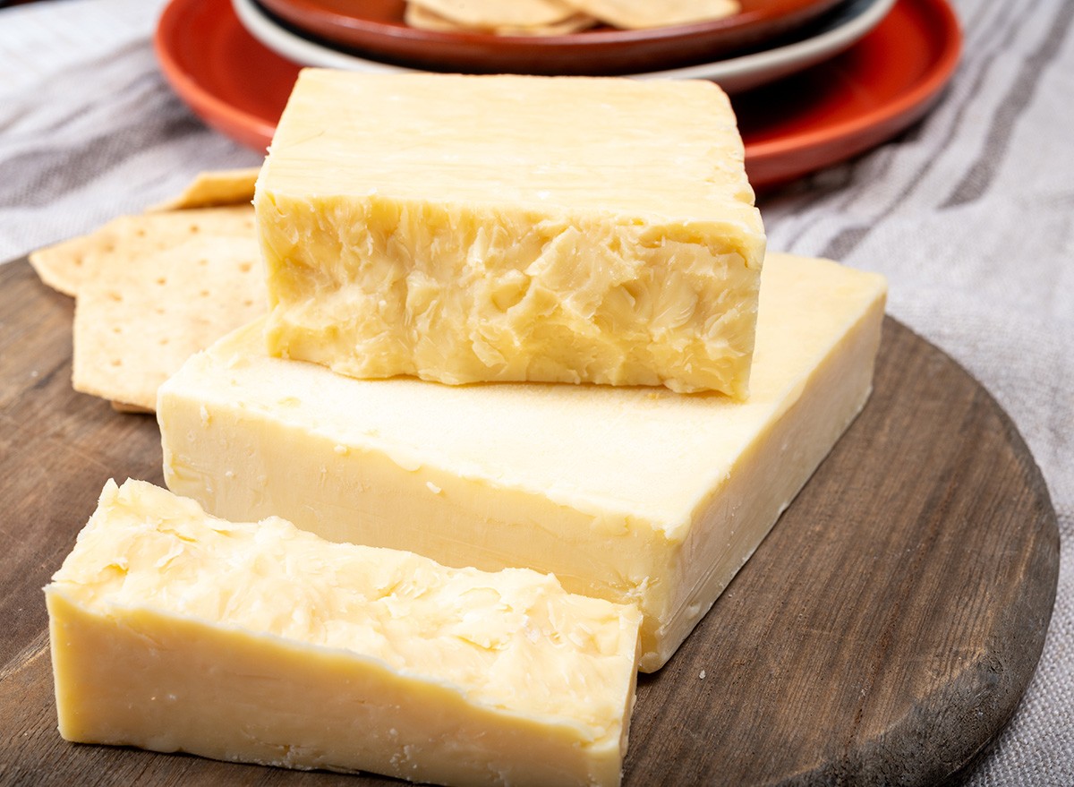 British cheeses collection, Scottish coloured and English matured cheddar cheeses close up
