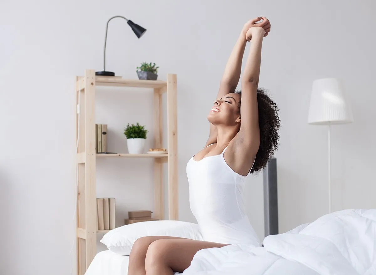 Cheerful woman is waking up, bed, bedroom, sleep, sleeping,