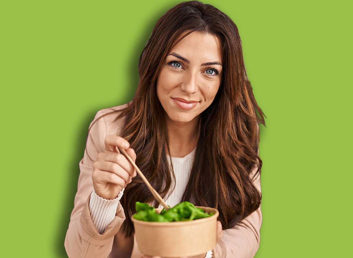 Young hispanic woman ecommerce business worker eating salad at office