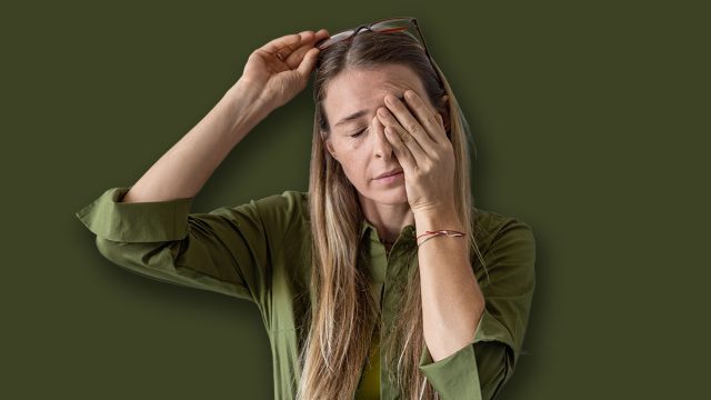 Sleepy woman suffering from chronic fatigue rubbing eyes on kitchen at home. Tired middle aged female feeling bad from lack of rest, headache, lack of energy after party, sleepless night.