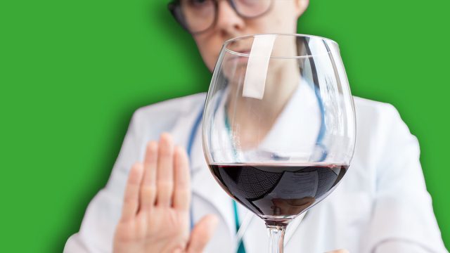 stop alcohol,doctor shows hand rejection of a alcoholic drinks