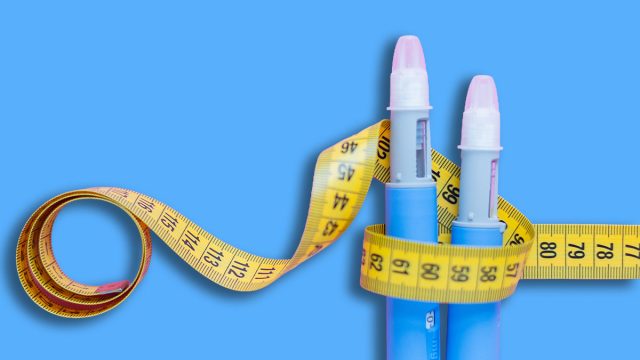 Insulin pens wrapped in a measuring tape on a pink surface, illustrating healthcare, weight management, and chronic illness support. drugs injection ozempic for weight loss