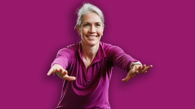 Mature group, woman and squat for exercise in gym, balance or coach for muscle development in class. Senior people, men and fitness for legs, smile or workout together in retirement at wellness club