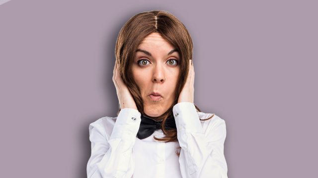 Waitress covering her ears