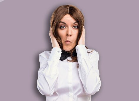 Waitress covering her ears