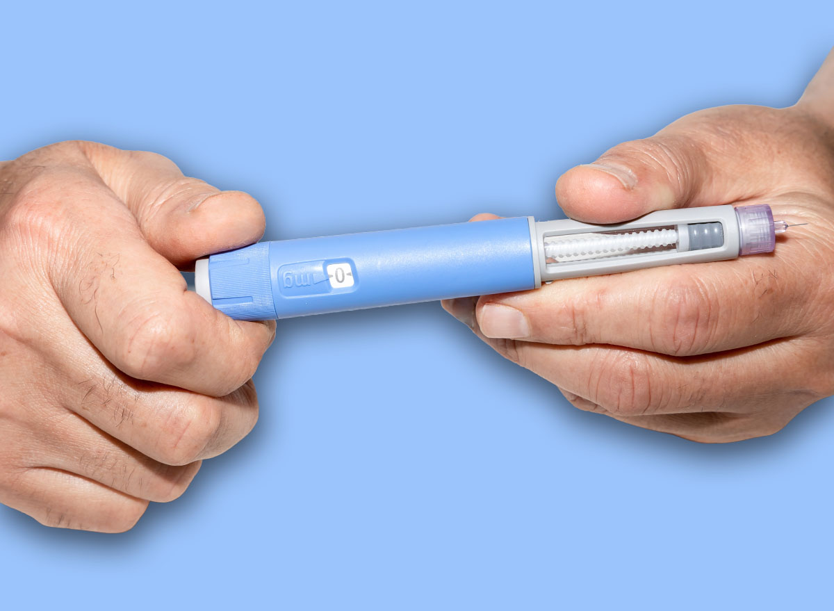Ozempic Insulin injection pen or insulin cartridge pen for diabetics. Man holding an injection pen for diabetic. Medical equipment for diabetes parients.
