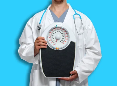 Medical doctor nutritionist with body scales. Weight loss.