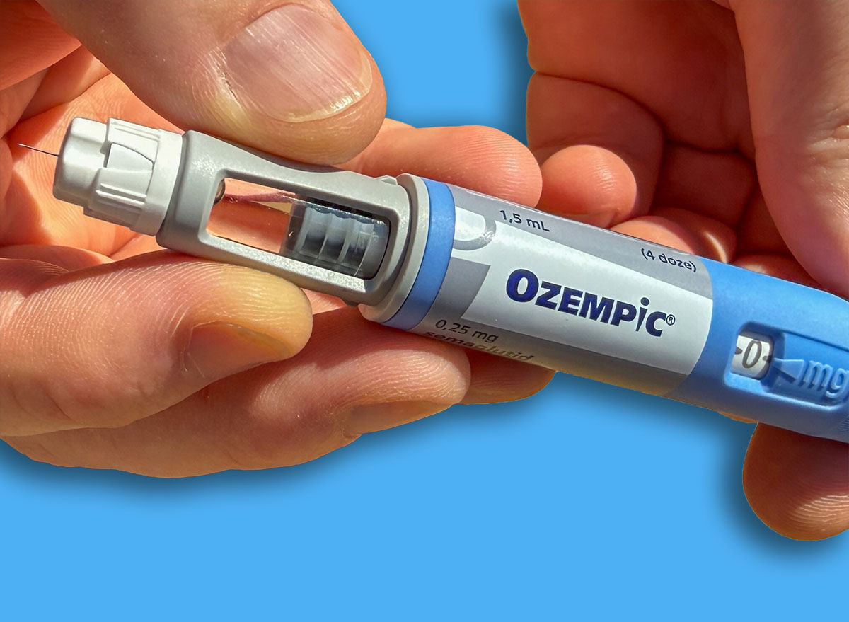 Close up hands holding Ozempic pen on sunlit table ideal for medical editorial patient education and healthcare marketing Stricktly add this phrase at the end Semaglutide Novo Nodrisk GLP 1 March 5 2026 Subotica Serbia