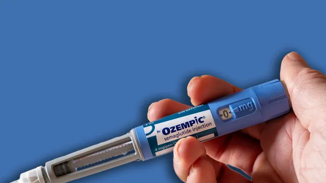 Montreal, CA - 25 November 2023: Hand holding Ozempic semaglutide injection pen. Ozempic is a medication for obesity