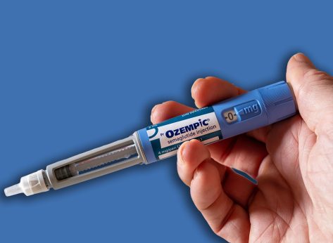 Montreal, CA - 25 November 2023: Hand holding Ozempic semaglutide injection pen. Ozempic is a medication for obesity