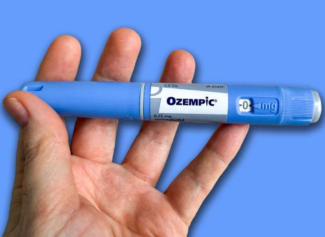 A hand cradles a mysterious blue pen, evoking whispers of medical alchemy and wellness resolutions, World Health Day; Ozempic, GLP 1, Semaglutide, January 5 2026, Subotica, Serbia